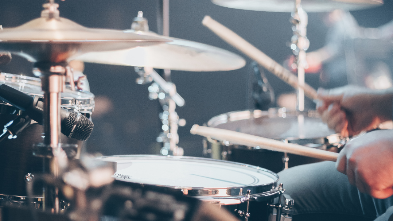 person-using-drums