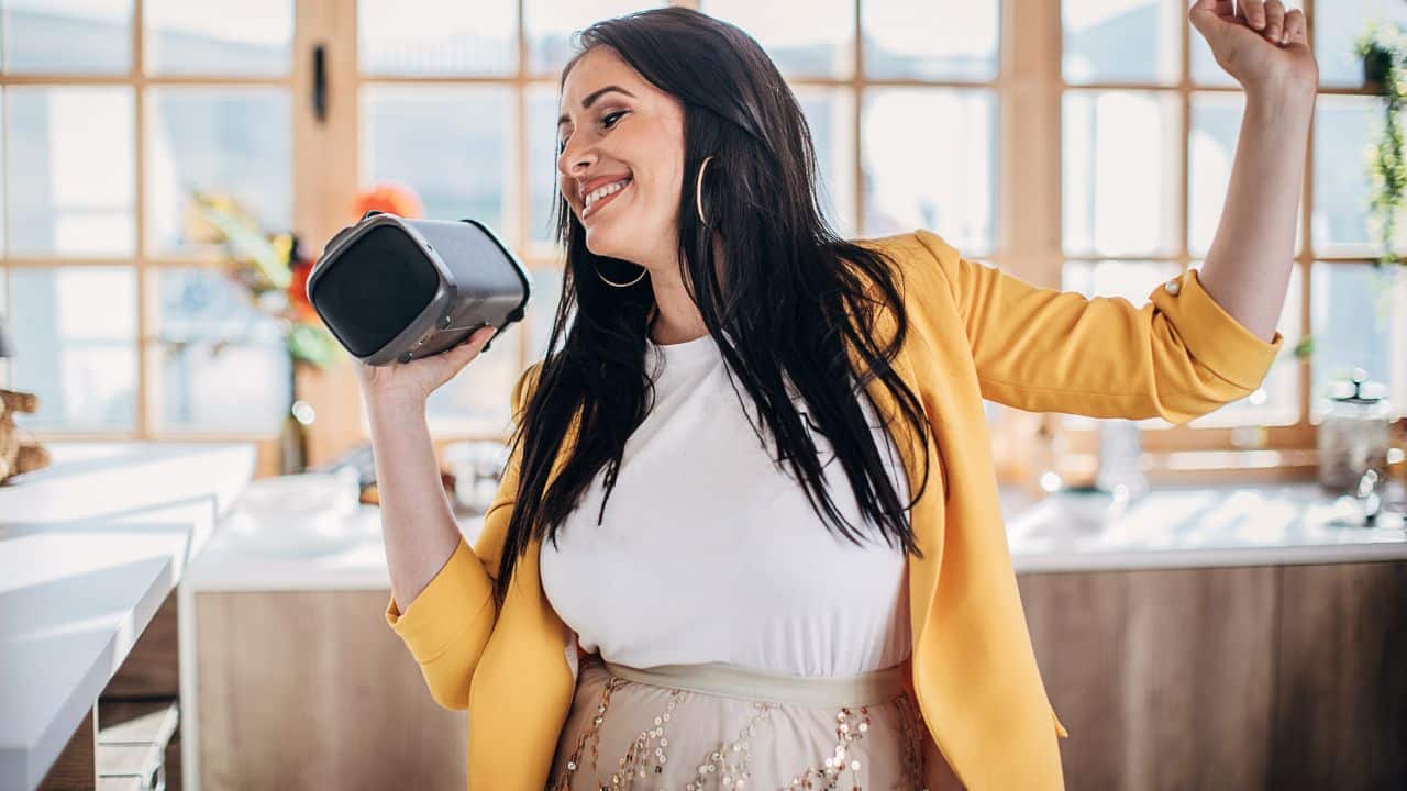 woman-holding-bluetooth-speaker
